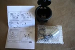 Ford AL3J-7804803-BAW Cup Holder With Cigarette Lighter Receptacle. Fixed Price $36.98.